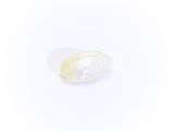 an oval white oplite stone with a white background