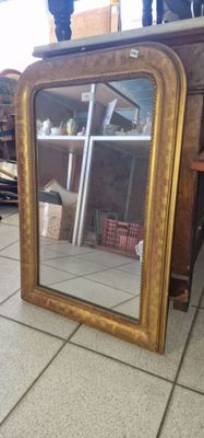 a mirror that is sitting on the floor in a room