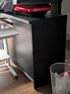 a television sitting on top of a cabinet in a living room