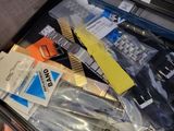 a person holding a tool kit in a case