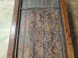 an old wooden table with a glass door on top of it