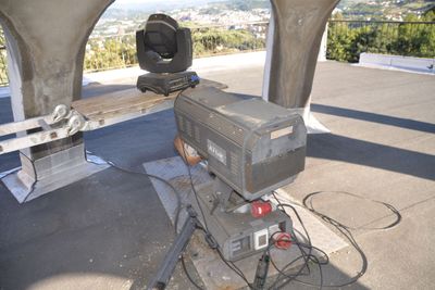 a large projector set up in a building with a view of the city