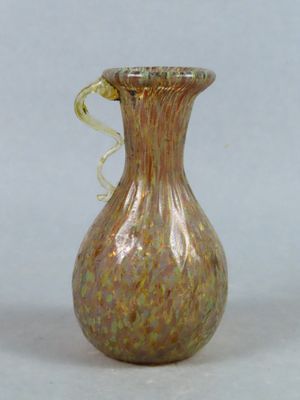 a glass vase that is sitting on a table
