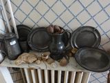 a lot of pots and pans that are on a table