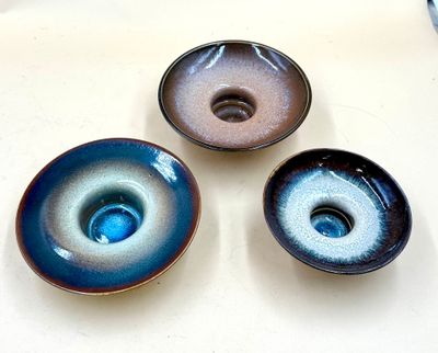 three bowls that are sitting on a table