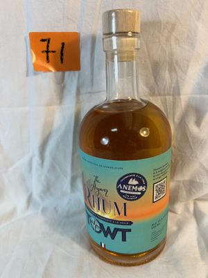 bottles of liquor sit on a table with a price tag on it