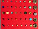 a red piece of fabric with buttons on it