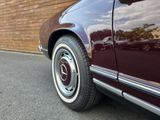 a close up of a car ' s tire on the street