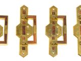 three brass door handles on a white background with a white background