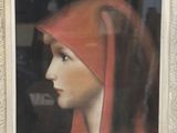 painting of a woman in a red headdress in a white frame