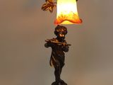 an image of a lamp that is on a table next to a wall