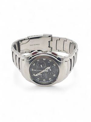 wrist watch on a white surface with a white background