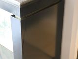 an image of a black refrigerator in a kitchen