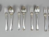 five forks and six spoons arranged in a row