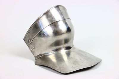 a silver helmet on a white surface with a white background