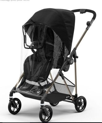 an image of a stroller with a rain cover on it