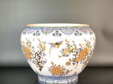 a close up of a vase on a table