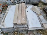 several pieces of wood are stacked on top of each other in a pile