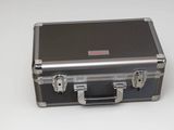 a metal case with two handles on a white surface