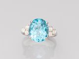 an oval blue topaze and diamond ring