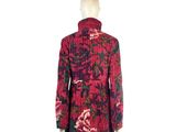 an image of a mannequin wearing a red and green floral dress