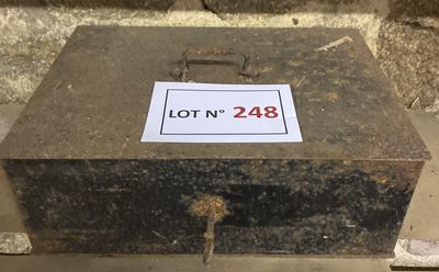 a stone box with a lot ' n 248 sign on it
