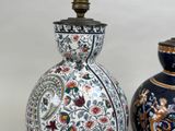 two vases sitting side by side on a table