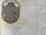 an old book with a drawing of a coat of arms on it