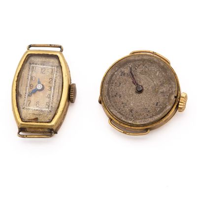 an image of two watches sitting next to each other on a white surface