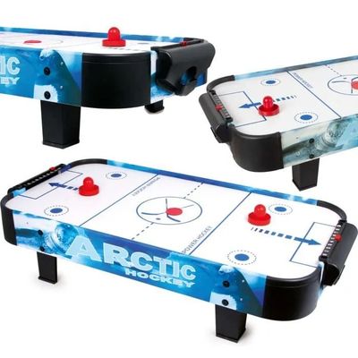 a close up of a table top air hockey game on a white background