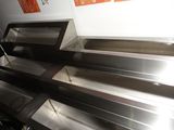 a metal shelf that has a bunch of empty items on it