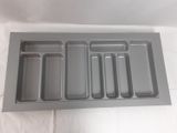a tray that has compartments in it on a white surface