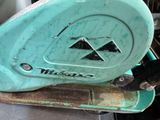 a green machine that is sitting on top of a table