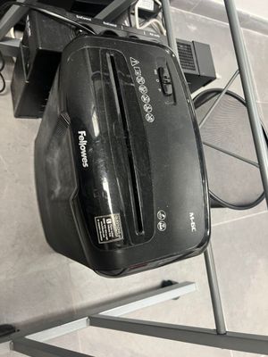 a black suitcase sitting on top of a metal rack