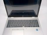 an open laptop computer sitting on top of a white table