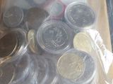 a package of coins sitting in a box on the table