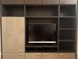 a picture of a living room with a flat screen tv