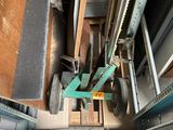 an overhead view of a machine that is moving a piece of wood