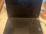 a laptop computer that is sitting on a desk