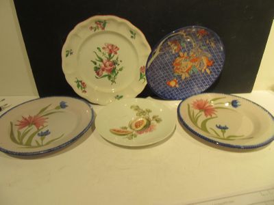 four plates that are sitting on top of a table