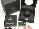 a black box with a watch inside of it and a watch inside of it