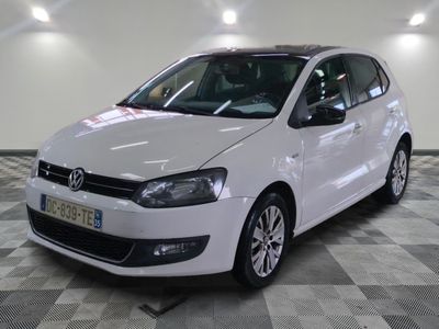 the white car is parked on a checkered floor in the garage