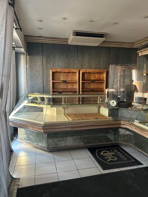 a glass display case in the middle of a room