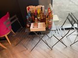 two chairs and a table with a book on it