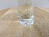 a glass of water sitting on top of a wooden table