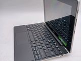 a laptop with a keyboard on it sitting on a table