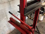 an image of a red machine in a garage