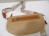 tan and white woven purse with a brown strap