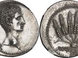 a silver coin with an image of a woman and wheat