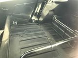 a picture of the inside of a car with the back seats folded down